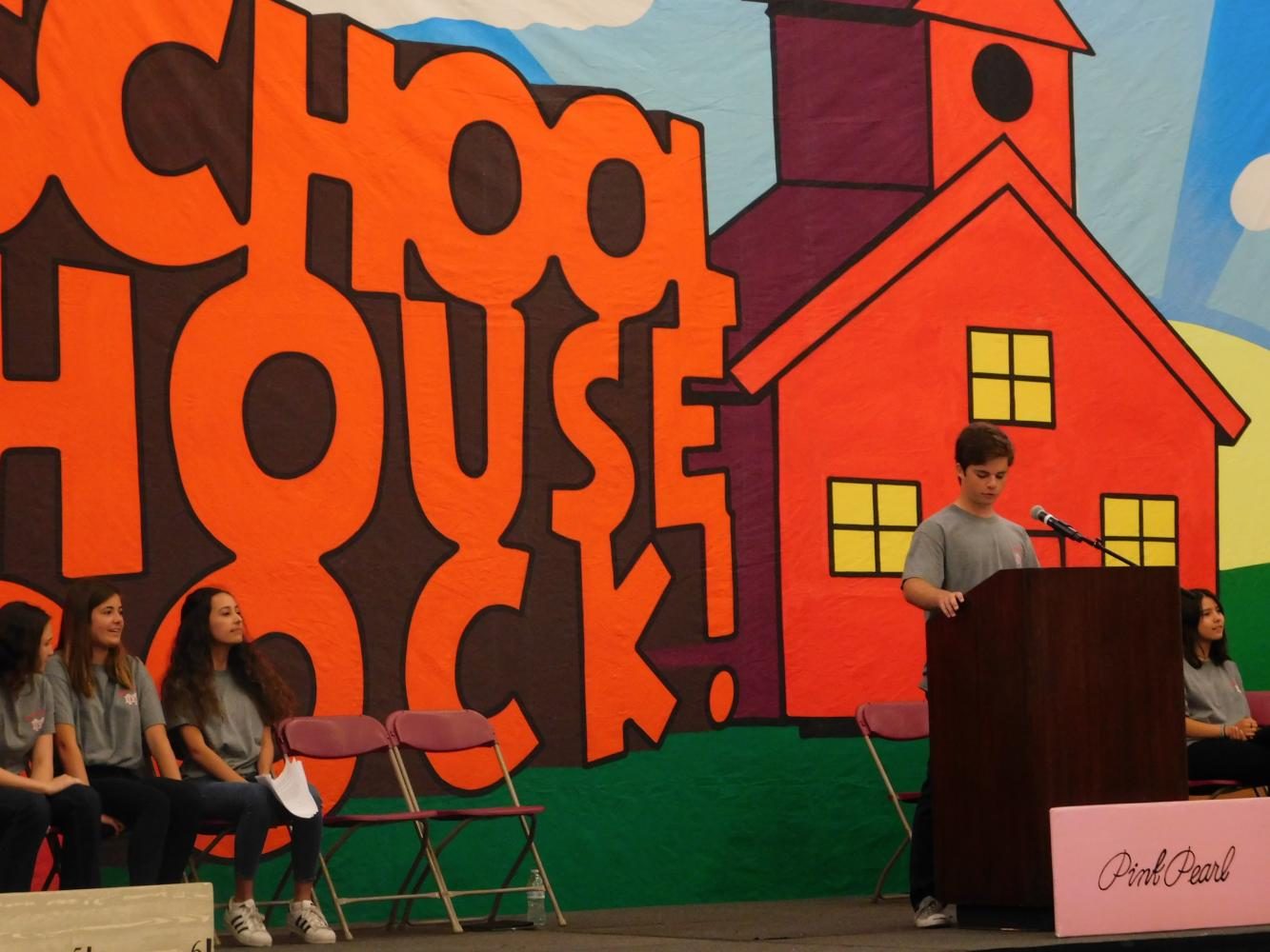 Junior Jack Chorbagian announces student awards.