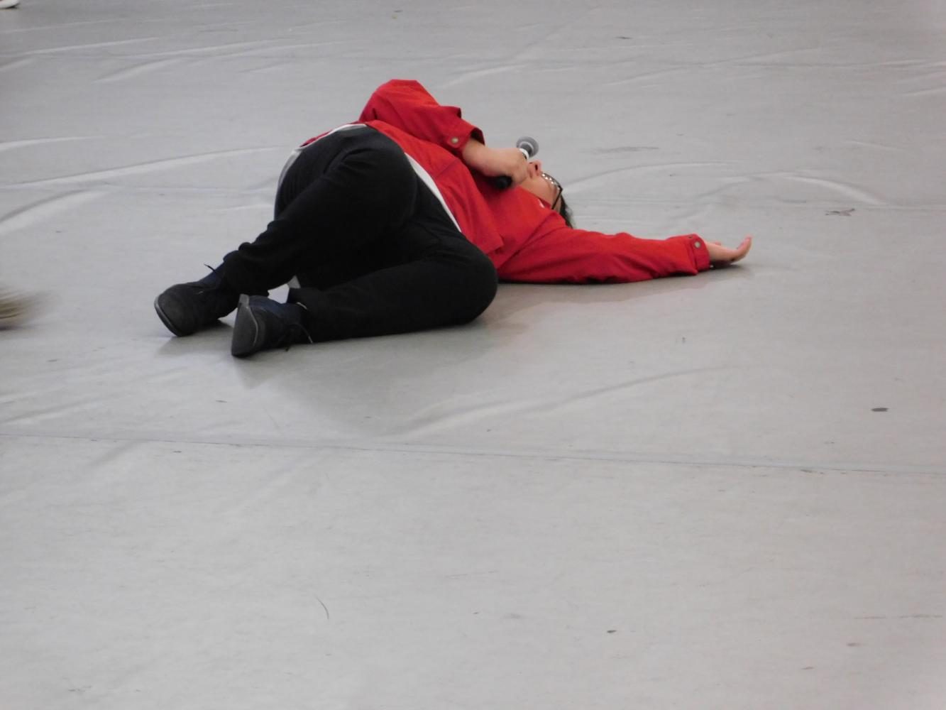 Senior Vicente Saintignon lays on the floor as a bee in an Improv skit about the dying bee population. 
