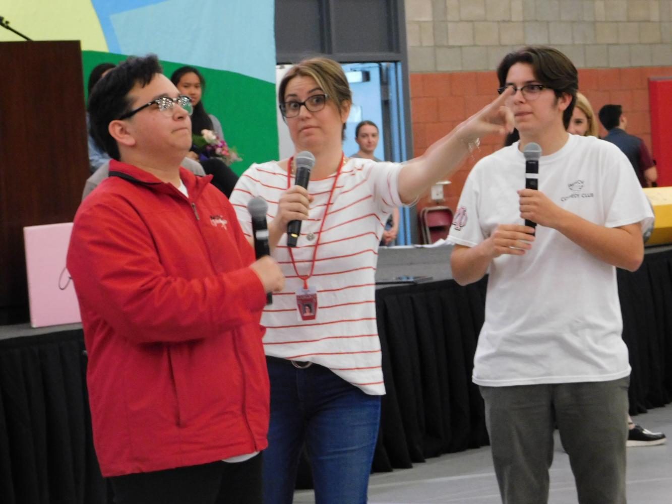 Jill Cavotta, Vicente Saintignon and Hunter Montano act in an Improv scene. In the scene, Cleopatra did not know how to spell her name at the DMV. 