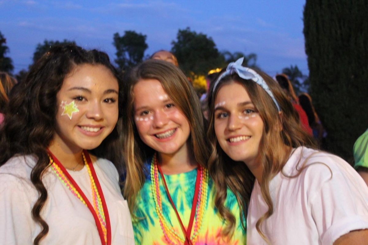 LIGHTS, CAMERA, DANCE : Tatiana Andry (left), Abby Snider (middle), and Laura Alfaro (right) are hanging out and laughing before they enter the 2017 Welcome Dance. They are cited to have there first all school dance as freshmen.  “The atmosphere of the dance was very fun and enthusiastic and the music was bomb.  Everyone was having fun and the food there was good.” said Tatiana Andry (grade 9).
