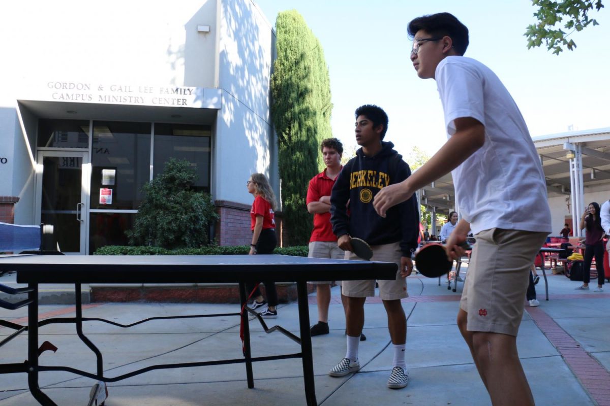 Senior Charlie Chen plays an intense game of Ping Pong as a returning player and member outside the LeVecke Center. The club often meets inside or outside the LeVecke Center.