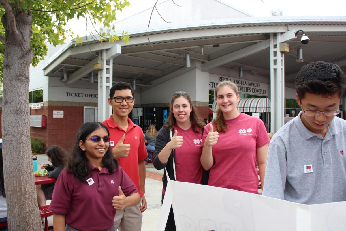 Left to right: Seniors Christelle DSa (Secretary), Tuan Do (President), Michaela Maguin, and Erica Rogers at the Ping Pong Club booth during Club Fair.