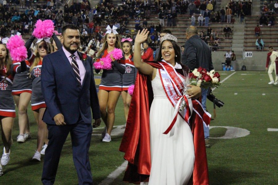 Senior April Hernandez waves to the MD crowd after being crowned 2017 Homecoming Queen.