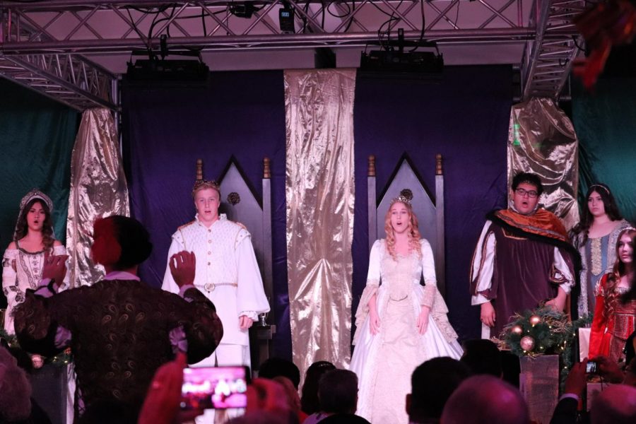 Daniel Kubeck and Amy Bush, named king and queen of this years Madrigal Feast, perform front and center this past weekend.