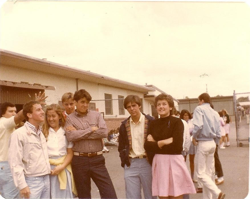 Seniors from the class of 1981 walk around campus in their uniforms. At the time, girls had the option of a blue skirt while the boys were allowed to any type of button-up shirt. 