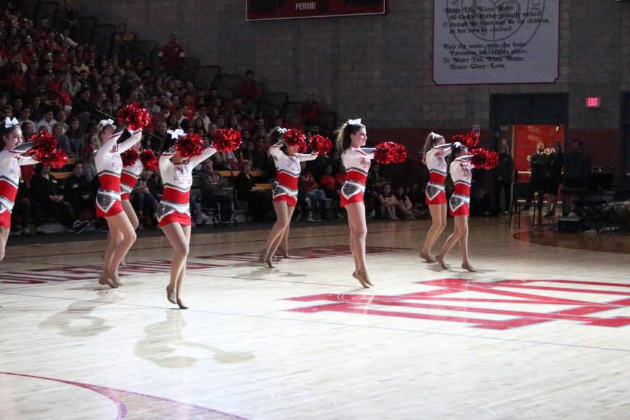 The cheer team performs at the Performing Arts Showcase in the Meruelo Athletic Center on February 22,2018. The Performing Arts Showcase recognizes the various students participating in performing arts, including the pep squad, the improv team, choir, All-Male Hip-Hop, the dance team, instrumental performance groups and theatre.