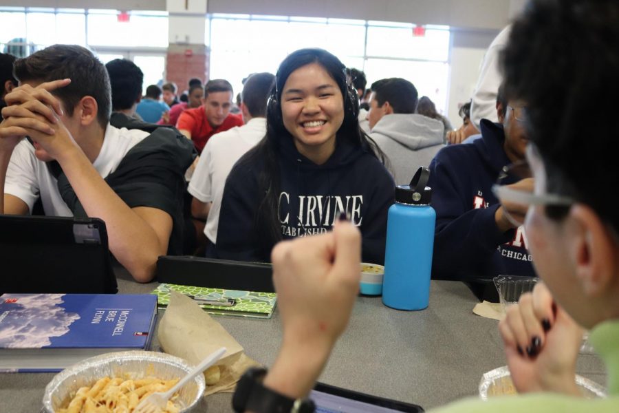 SILLY SMILES: Senior Maithu Tran laughs as a friend sitting across from her - senior Claire LaFont - demonstrates a silly dance while at lunch in the LeVecke Center. Tran was one of the 11 ASL IV students to participate in the Deaf for a Day experience on Oct. 3.