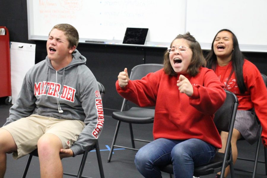 SINGING STUDENTS: While performing improvised scenes in front of their peers, students from Andrea Fouts Block 4 class make fun of celebrities and stereotypes. Practicing improvised scenes is one of many different exercises that Fouts has incorporated into her new theatre classes.