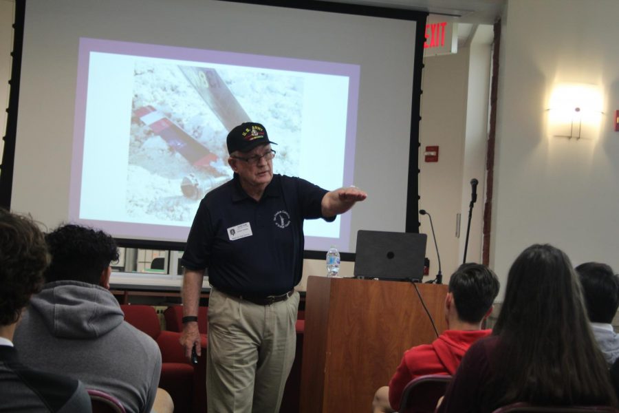 James Grimm, a veteran who fought in the Vietnam war, speaks to the junior students on April 3 in the school library. All junior level U.S. history classes were invited to hear Grimms stories during their time in service. When describing the camaraderie among the soldiers, Grim told his listeners that in the army you dont do anything as I, its we.