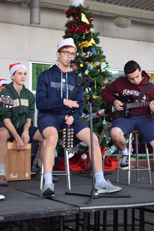 PERRY CHRISTMAS: Solorio creates a beat with bells as he sings the Phineas and Ferb theme song with a Christmas twist. Solorio has been playing guitar since his junior year. “To perform on stage in front of crowds is an amazing feeling because entertaining crowds has been something I wanted to do and being in this program allows me to do that,” Solorio said. 