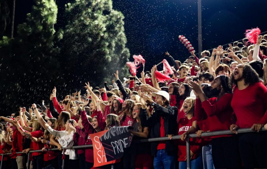 THE+DEN%3A+The+Mater+Dei+student+section+celebrates+a+touchdown+during+the+Varsity+game+versus+La+Mirada.+Students+from+every+grade+level+make+their+way+to+the+Santa+Ana+Bowl+in+order+to+support+their+fellow+Monarchs.+%E2%80%9CIt+feels+so+exciting+to+cheer+on+a+team+that%E2%80%99s+winning%2C%E2%80%9D+yell+leader+and+senior+Gina+Genova+said.+%E2%80%9CYou+can+barely+hear+yourself+because+everyone+is+screaming+with+you.%E2%80%9D+%28Photo+courtesy+of+Rachel+O%E2%80%99Sullivan%29+