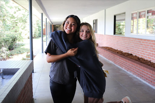 A MONARCH’S LIFE Junior Lauren Lee and her shadow, Cloey Barfield, end Barfield’s shadow day with bright smiles. They were paired together through Mater Dei’s shadow system for their shared interest in choir and AP/Honors courses. Lee expresses her enjoyment in showing Barfield around campus. “My favorite part about hosting Cloey as a shadow was being able to show her all of the unique and interesting opportunities that Mater Dei has to offer,” Lee said. Photo by Ava Gomez.