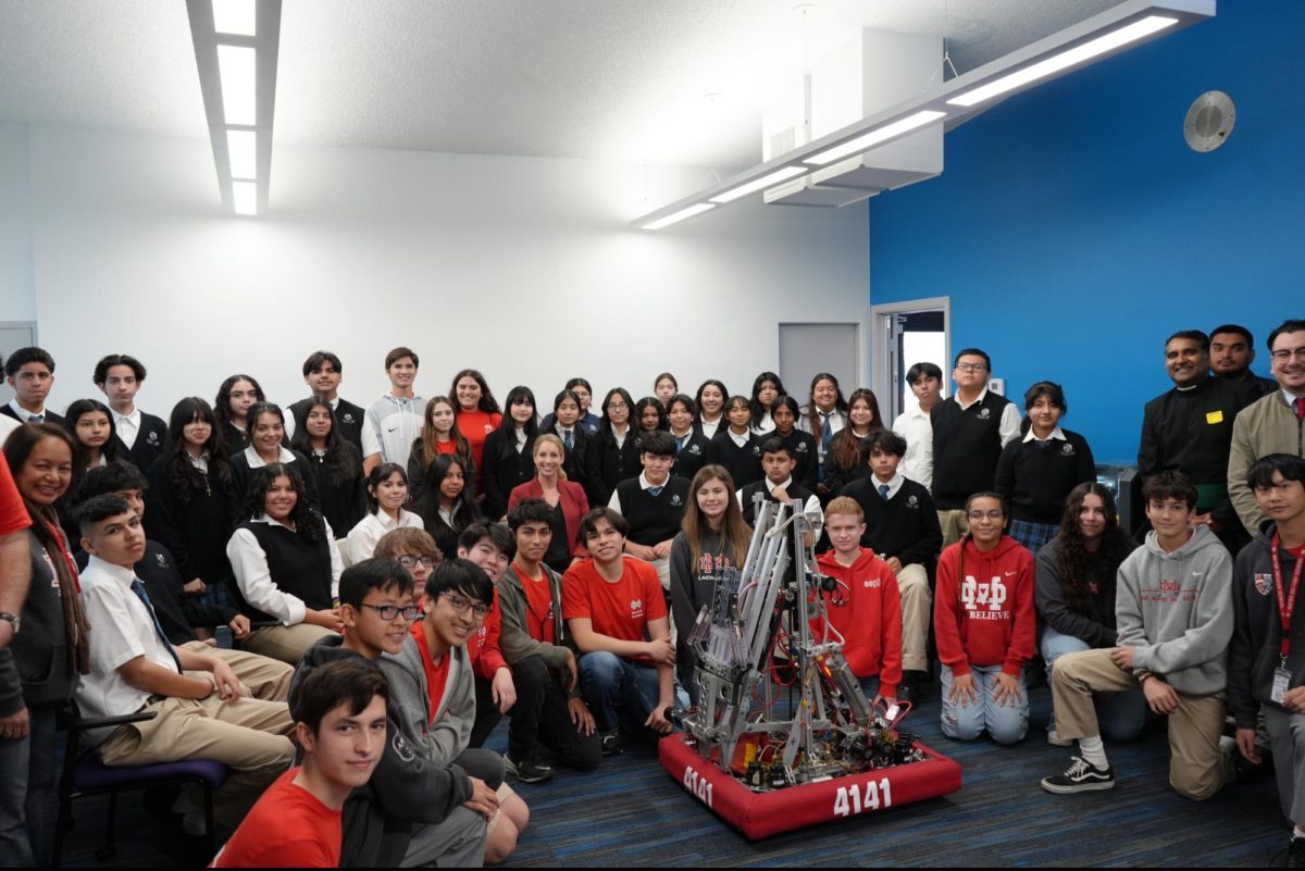 ROBOTICS GIVES BACK The Mater Dei’s Robotics Team visited Cristo Rey High School this year for their annual outreach. They were able to share valuable information and resources with the students there, helping bring S.T.E.M. to an underfunded school. By doing this, they hope to spark new interests in students attending school, and open them up to a world they may not be familiar with yet. Photo courtesy of Brother Joseph Anoop. 

