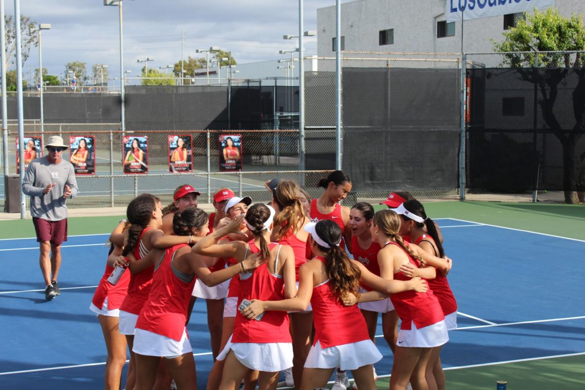 THE FINAL MATCH Girls’ Junior Varsity Tennis say their final prayer and team cheer prior to their last match against Santa Margarita on Oct. 23, 2023. Photo by Sky Vessels.
