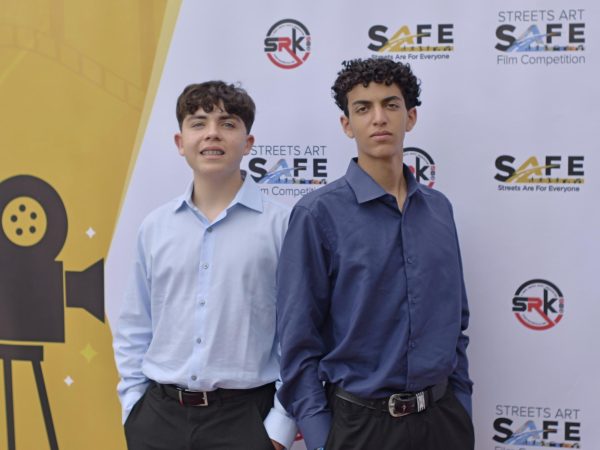 Filmmaking II students Andrew Roqueni and Matteo Dawson pose for the organization, Safe Streets Are For Everyone, red carpet affair. On May 4, the two attended the SAFE PSA awards ceremony along with their guide and mentor, Film and Media Arts Director Andrew Roberts. Although this is the first contest that Mater Dei’s filmmaking class has entered, Roqueni and Dawson represented the school with their great potential and confident abilities in creative cinematography. Dawson is grateful for the chance to celebrate these gifts and his love for creating. “The project was just really fun. I love filming, cameras, and everything like that,” Dawson said. Photo courtesy of Andrew Roberts.
