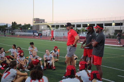 STRATEGY IS KEY Head Coach Josh Goedl discusses game plays and strategy during a break. Athletes like senior Leigh Stout find that communication is an important aspect of the game. “Having a community that actually cares how you're doing, cares about how you play, [and] your mental health, is a good type of team to depend on,” Stout said. 