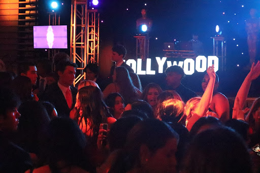 DANCE THE NIGHT AWAY A crowd of students sway and celebrate at the 2023 Mater Dei Homecoming Dance. Students, like senior Hailey Foster, find the dancing to be their favorite part of the event. “The best part of Homecoming, I would say, is the last two hours of the dance,” Foster said. “Because those last two hours are always the hours where you're dancing, and the people that want to dance are there, and you're able to just have fun.”