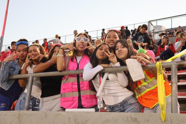 CHEERING TIME: Current Monarchs share excitement and school spirit in the student section at the Santa Ana Bowl during the game between Mater Dei and St. Frances Academy on Sept. 20. Sophomore Carson Schwartze enjoys going to games and supporting the team. “[The crowds are] really social,” Schwartze said. “[And] you can kind of see what players are [planning] in real-time.”