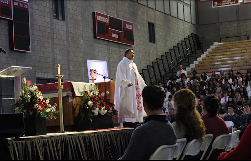 CELEBRATION IN FAITH AND UNITY Chaplain Father Mark Cruz gives his homily on bringing together a community of people blessed with Catholic education. Catholic Schools Week (CSW) is for celebrating how Catholic education has changed our lives. “I believe Mass plays a huge role in CSW because it reminds us how crucial faith is to our everyday lives,” Delaney said. “During CSW not only should we thank our faculty and staff, but also [remember] that CSW is centered around our connection to God.” 