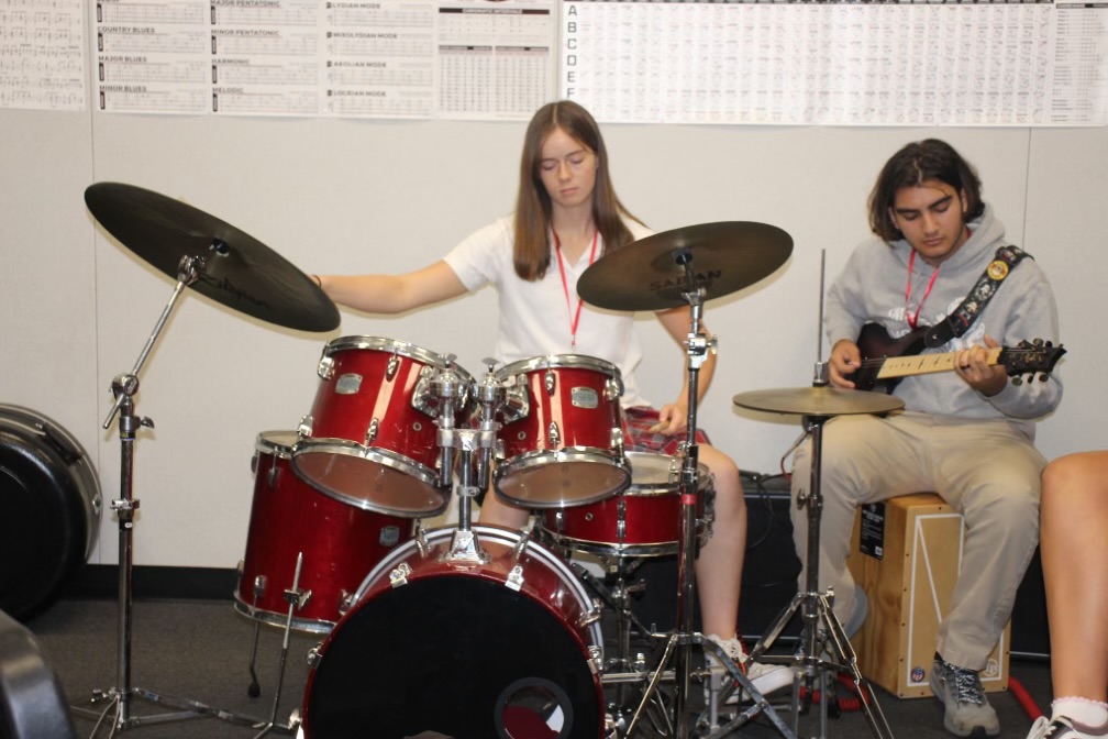 MORE THAN JUST GUITAR Seniors Katherine Allen and David Oswald play together in perfect harmony. The Guitar program is much more than just guitars, it also includes various other percussion instruments. “You can find guitars, pianos, drums, basses, tambourines, and many more [instruments]!” Gonzalez said. Photo by Cheyenne Torres