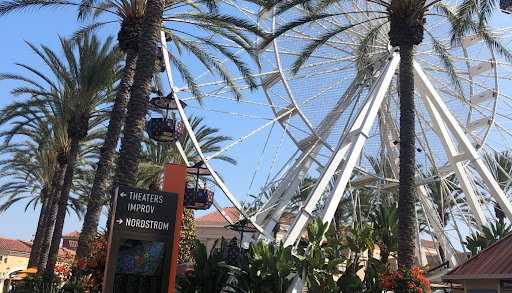 SPINNING INTO FUN The iconic Ferris wheel at the Irvine Spectrum stands glimmering in the sun, drawing visitors from all over Orange County. A favorite destination for Mater Dei students, the Spectrum offers endless opportunities for shopping, dining, and entertainment. “[It’s] a lot of fun,” sophomore Matthew Delaney said. “[And] everything is close by, so it’s a great way to pass the hours.” Photo by 