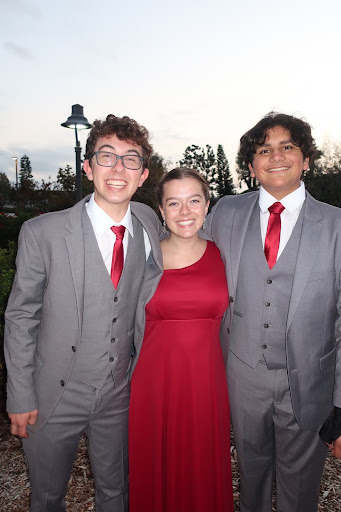 ALL SET TO PERFORM Juniors Thomas Mitchell, Diego Casarin, and senior Grace Henze pose in front of Our Lady Queen of Angels Catholic Church, ready to perform for the annual Fall Concert. From Oct. 20 to Oct. 21, Chambers singers took the stage to showcase their vocal talent and celebrate months of dedicated preparation to the Mater Dei community. “This was my first year in Chambers, and I’m just proud that I get to do what I love with my best friends, especially because there’s so many hours that go into our rehearsals,” Henze said. Photo courtesy of 