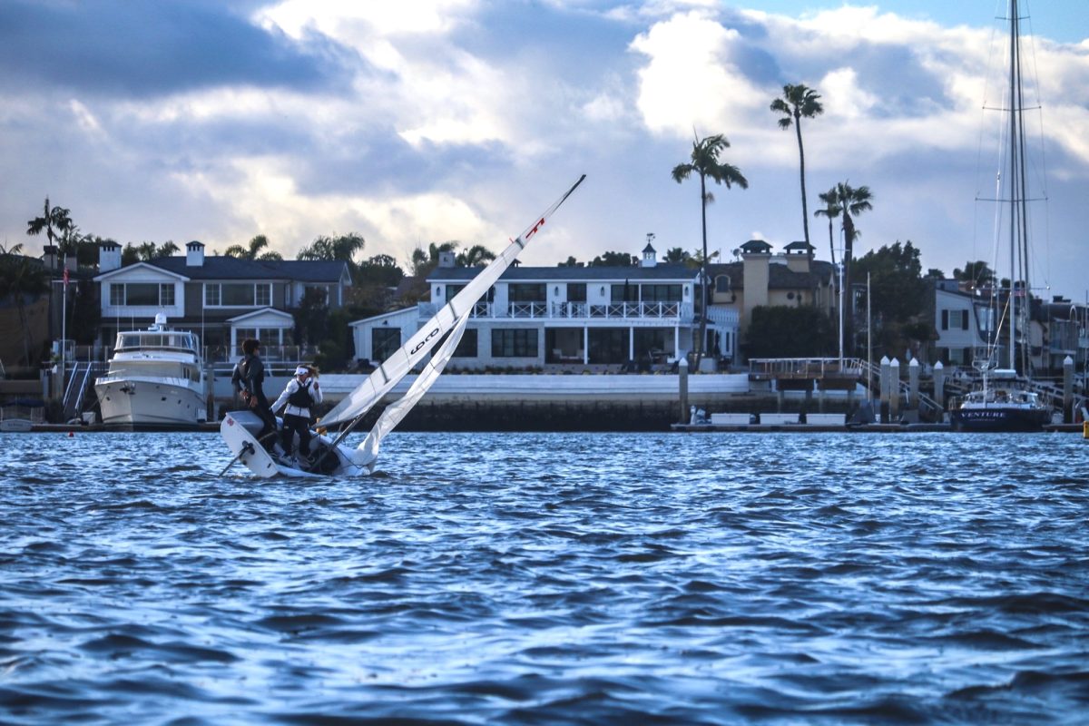 OUT ON THE WATER Senior William Sangmeister sails in Newport Harbor, practicing for upcoming regattas. After school on Tuesdays and Thursdays, the sailing team practices for upcoming competitions. “I’m excited for the season as we have a lot of talent this year,” Sangmeister said.