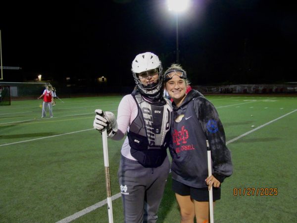 PRECISION AND SPEED Sophomore Mia Games and junior Mia De Van Der Stein pose for a photo during varsity practice. Games is a goalie who alternates between both the JV and varsity teams, while De Van Der Stein plays midfielder on the varsity team. Both showcase exceptional talent and commitment towards the sport. “Defining success as an athlete is just putting 100% effort all the time,” De Van Der Stein said. “In my opinion, it also affects how you perform, it's okay if you don't perform at 100% all the time, but as long as you put your best effort and interest at heart, it's what counts at the end of the day, because it really means that you're trying, and eventually the success will be there.”