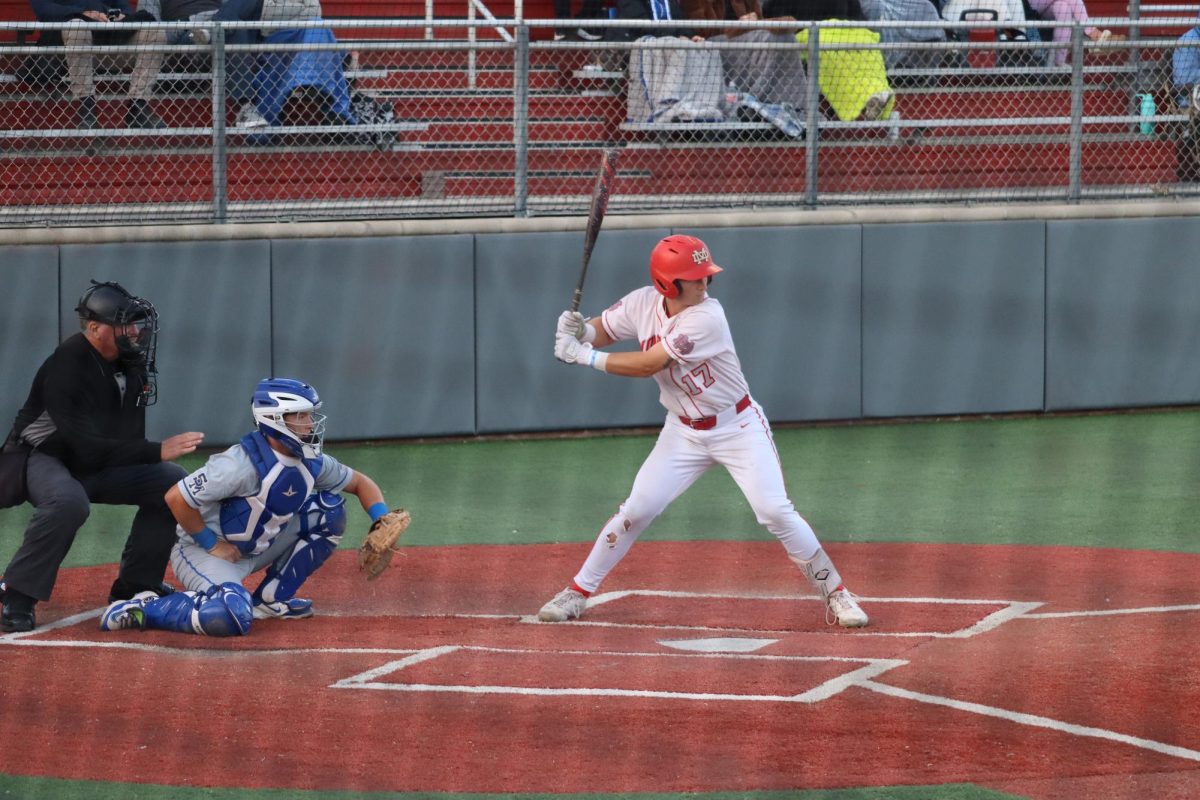 ALL IN THE SWING Senior Dylan Wetzel gears up for a swing during the second Trinity League game of the season. On Wednesday, Apr. 3, the Mater Dei Monarchs secured a victory over the Santa Margarita Eagles. During stressful moments on the field, Wetzel finds strength by carrying out what his brother had taught him, and the belief that he has in himself every step of the way. “My brother motivates me every time I step on the field,” Wetzel said. “He is my biggest supporter and wants me to succeed.”