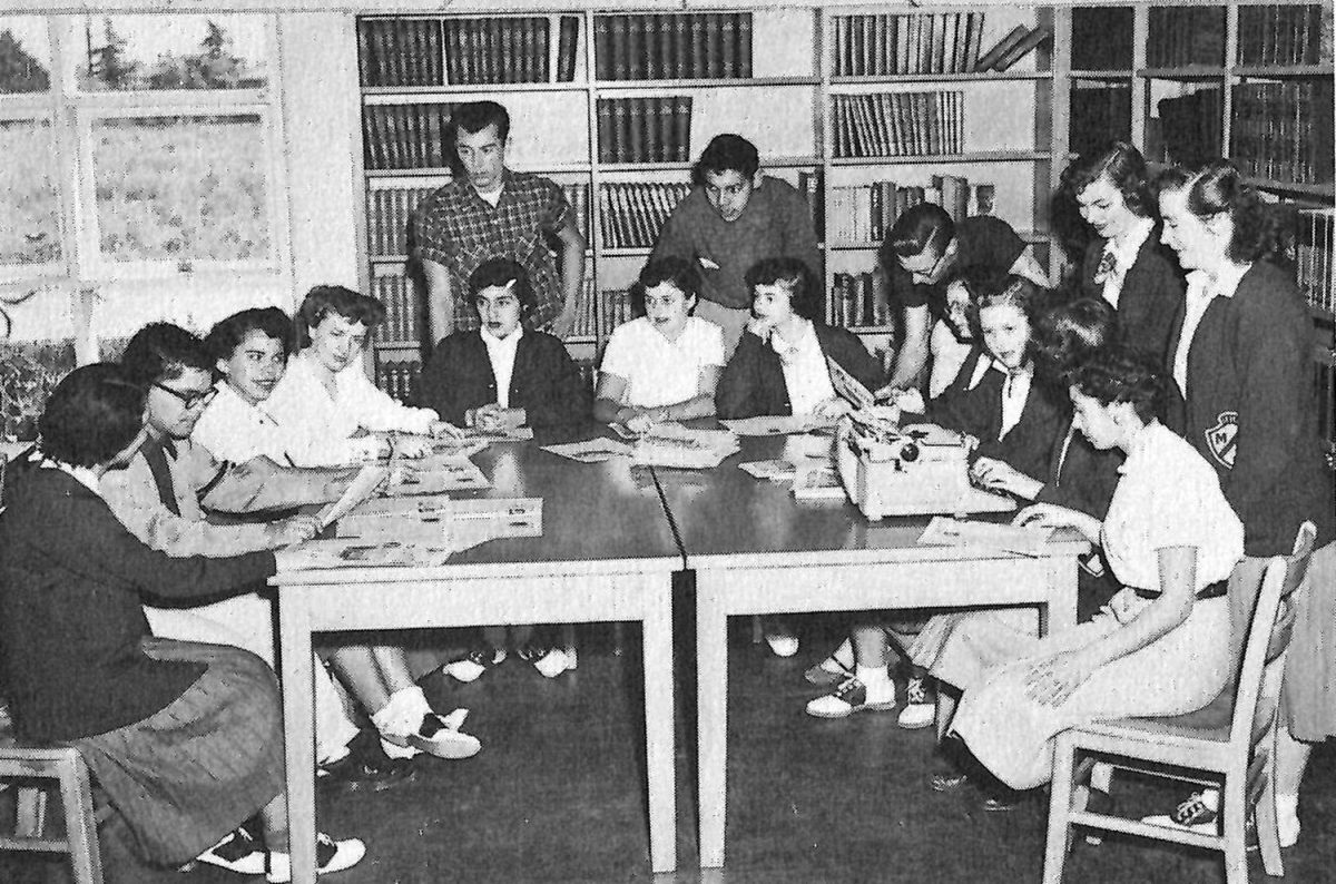 FRIENDSHIP IN PRINT Members of the Hi-Lighter student newspaper gather for a press conference in 1954. Among them is senior Lenore Rigney (O’Hara), who had worked on the publication for two years after transferring to Mater Dei as a junior. “I found the students were all so friendly and accepting,” O’Hara said. “It was [important] to be friendly to someone new and to help them get used to the school and make friends.”