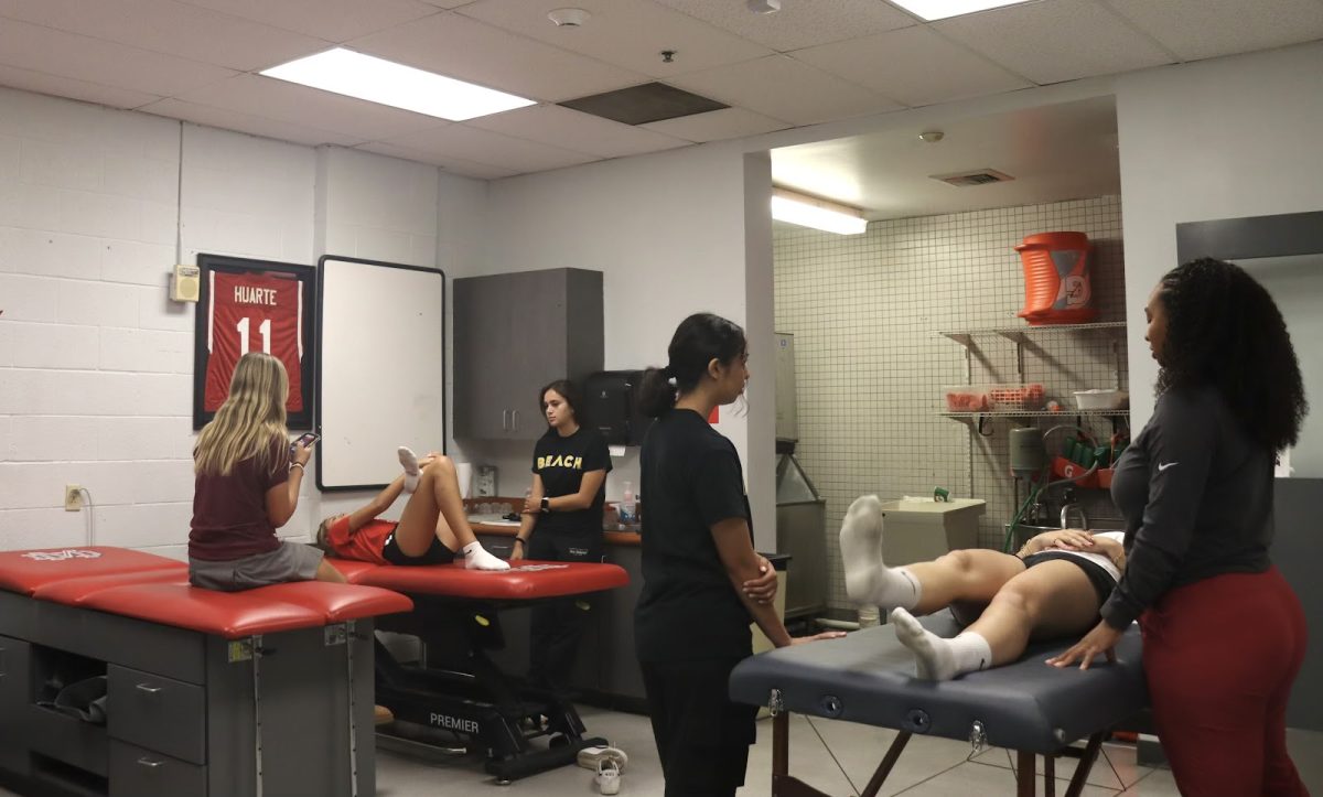 ATHLETE RECOVERY Athletes undergo evaluations and work on injury recovery in Mater Deis Physical Training room. Addressing injuries early and consistently is essential to healing and maintaining a balanced athletic schedule. "It's really important to get diagnosed properly," Boys and Girls Tennis Head Coach Adrian Games said. "Once you find out the diagnosis, then you have to create a return plan and that usually includes physical therapy."