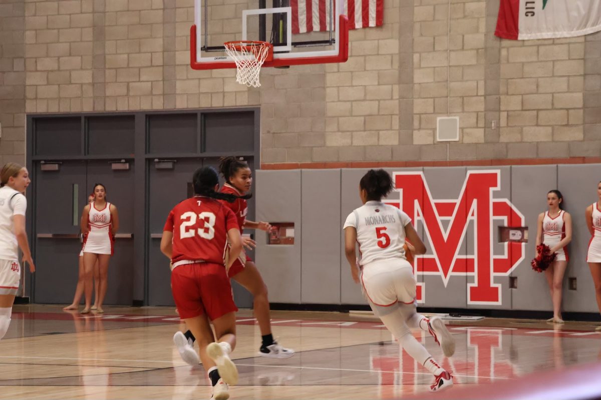 NOTHING BUT NET Junior Harmony Golightly #5 faces off against opposing Orange Lutheran athletes. When challenged, Golightly learns to adopt leadership habits and take charge in difficult situations. “We have leaders on the team,” Golightly said. “They're able to speak up, encourage others, and [help us] to be better.” Photo by Natalie Flores.
NOTHING BUT NET Junior Harmony Golightly #5 faces off against opposing Orange Lutheran athletes. When challenged, Golightly learns to adopt leadership habits and take charge in difficult situations. “We have leaders on the team,” Golightly said. “They're able to speak up, encourage others, and [help us] to be better.” 